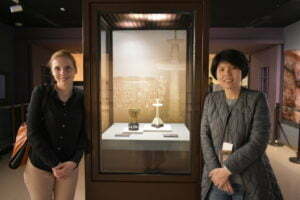 Yili Hou and I standing next to the ‘Gold Cup of Eternal Stability’ at the National Palace Museum, Taipei.