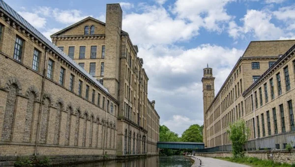 Disused area of Salts Mill in Saltaire to become new home of museum about peace © Salts Mill and New Mill by the Leeds Liverpool Canal