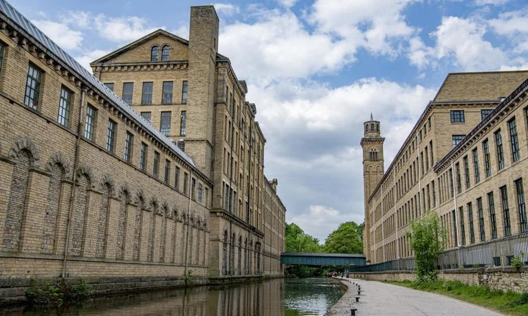 Disused area of Salts Mill in Saltaire to become new home of museum about peace © Salts Mill and New Mill by the Leeds Liverpool Canal