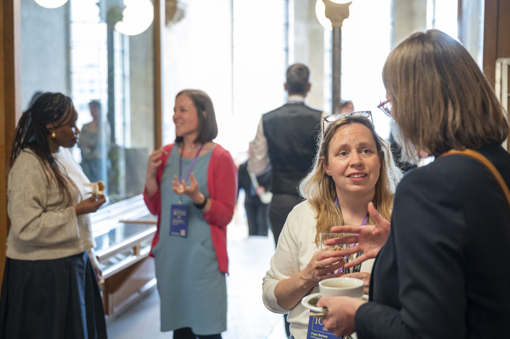 People Chatting In Oxford Natural History Corridor With Tea